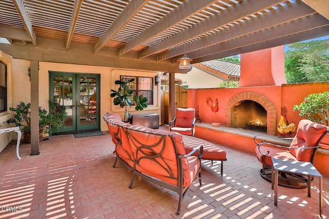 view of patio featuring a pergola, an outdoor living space with a fireplace, and french doors