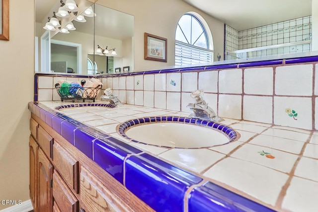 bathroom with backsplash and vanity