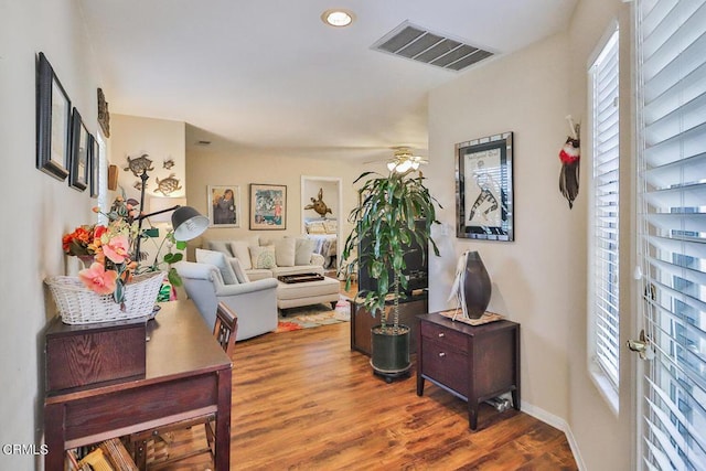 interior space featuring ceiling fan and dark hardwood / wood-style flooring