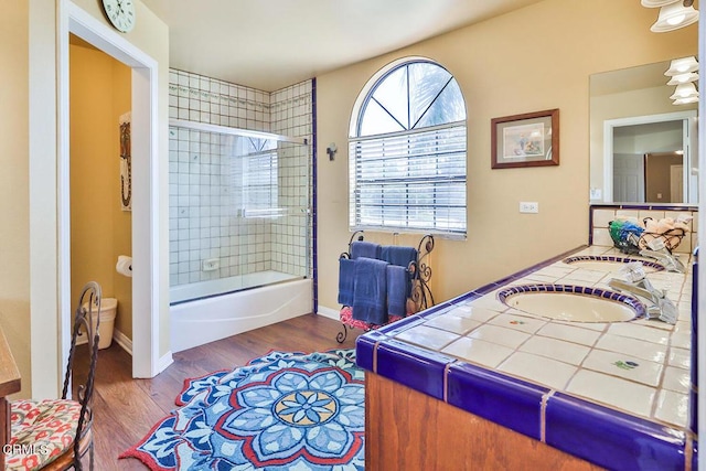 bedroom featuring wood-type flooring and sink