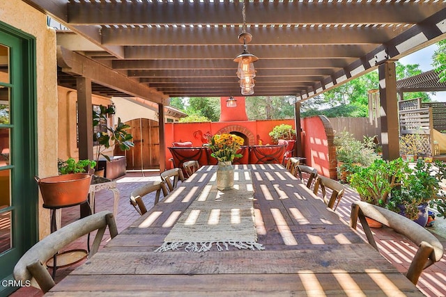 view of patio / terrace featuring a pergola and an outdoor fireplace