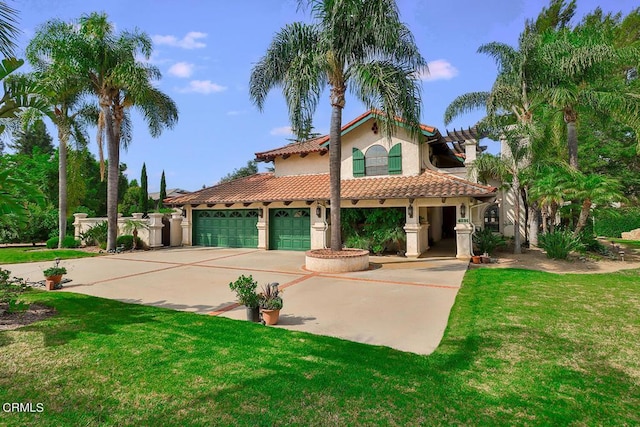 mediterranean / spanish-style home featuring a front yard