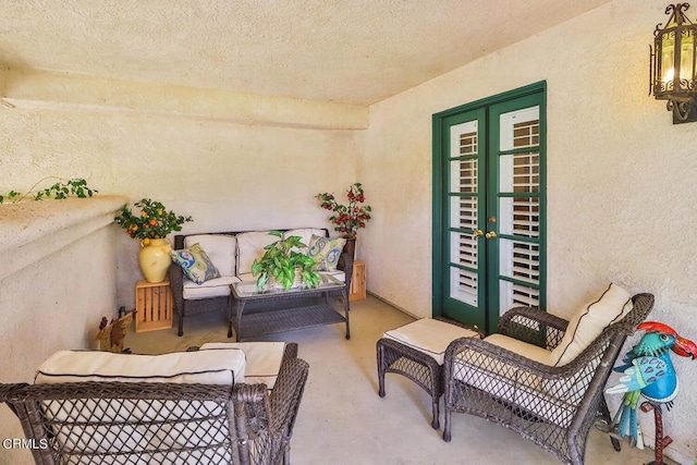 balcony with an outdoor living space and french doors