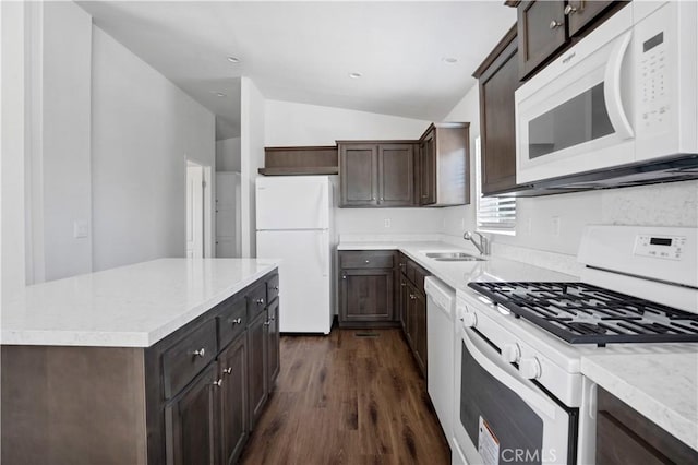 kitchen with white appliances, vaulted ceiling, sink, a center island, and dark hardwood / wood-style floors