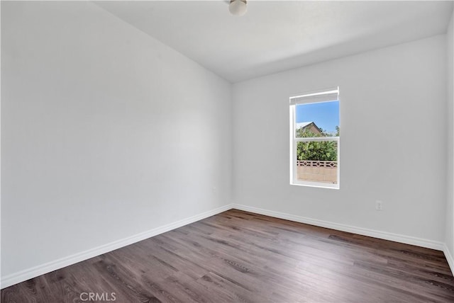 spare room featuring wood-type flooring