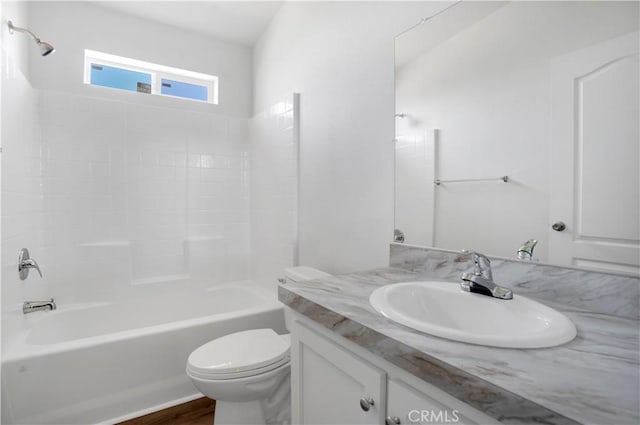 full bathroom with toilet, wood-type flooring, vanity, and bathing tub / shower combination