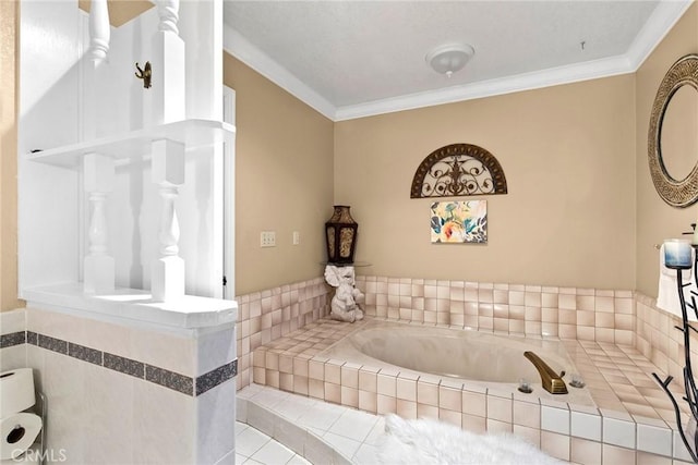 bathroom with tiled tub and crown molding