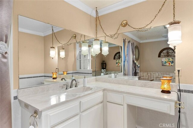 bathroom featuring ornamental molding and vanity