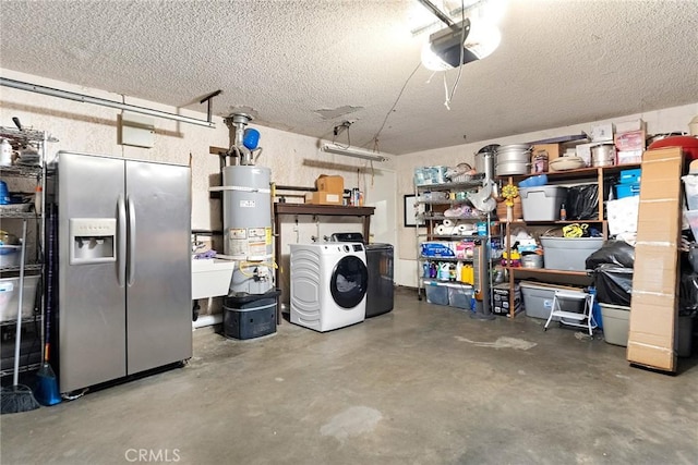 garage with washing machine and dryer, sink, secured water heater, stainless steel fridge, and a garage door opener