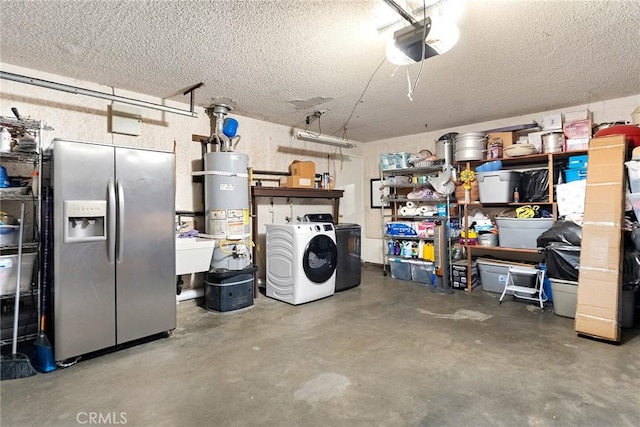 garage with a sink, stainless steel fridge, a garage door opener, secured water heater, and washer and dryer