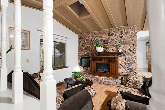 tiled living room with vaulted ceiling, a stone fireplace, and wooden ceiling