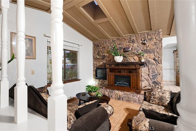living area featuring tile patterned floors, vaulted ceiling with beams, and a fireplace