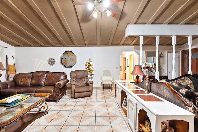 tiled living room featuring ceiling fan and wood ceiling