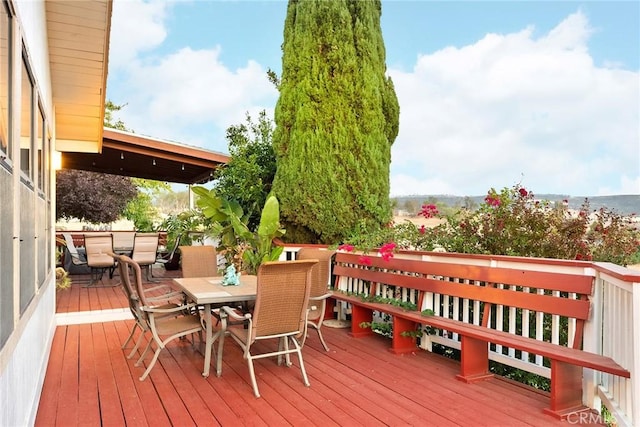 deck with outdoor dining space
