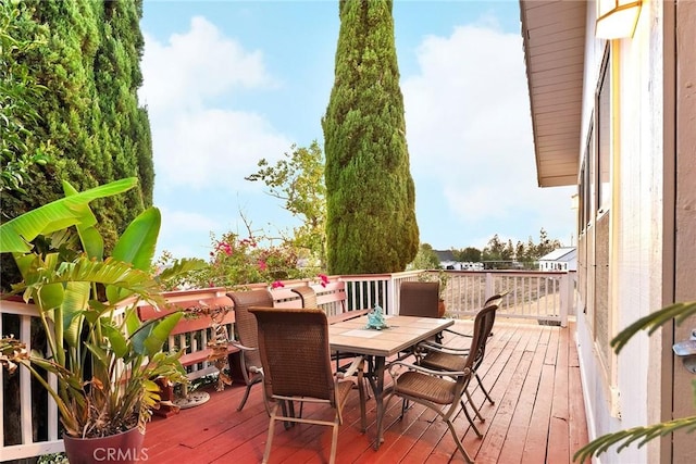deck with outdoor dining area