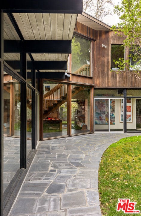 entrance to property featuring a patio area