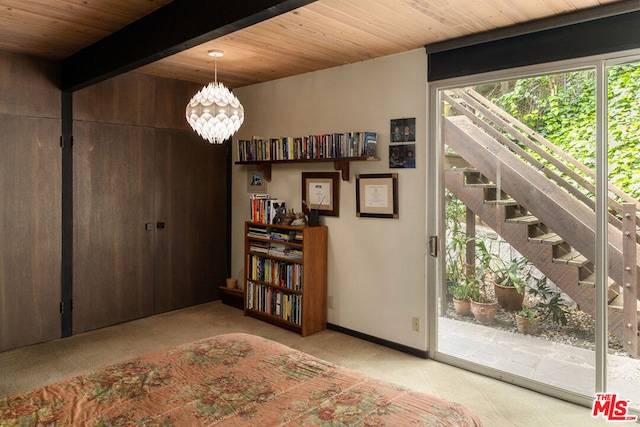 interior space featuring beamed ceiling, a notable chandelier, wooden ceiling, and a healthy amount of sunlight