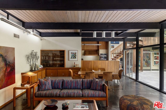 living room with expansive windows, beam ceiling, and wooden ceiling