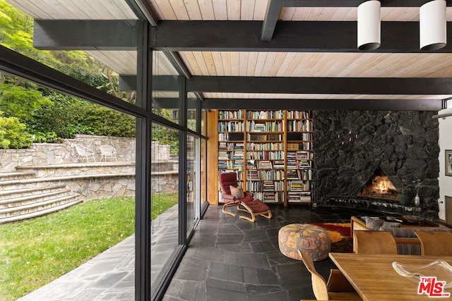 view of patio featuring an outdoor stone fireplace