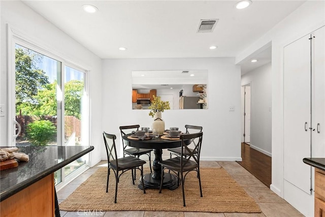 dining area featuring light tile patterned floors