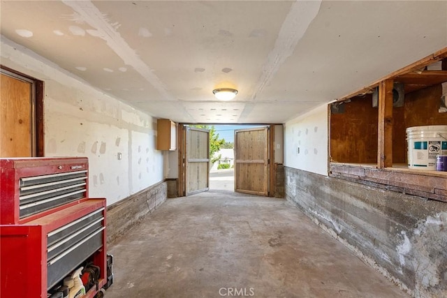 misc room with concrete flooring