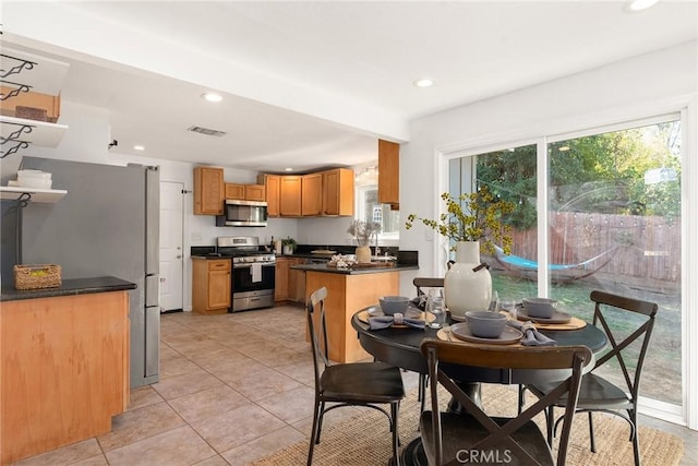 dining space featuring light tile patterned floors