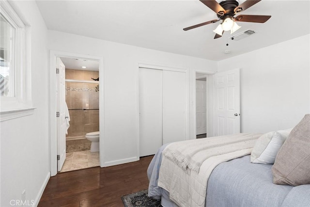 bedroom featuring ceiling fan, a closet, dark hardwood / wood-style flooring, and ensuite bathroom