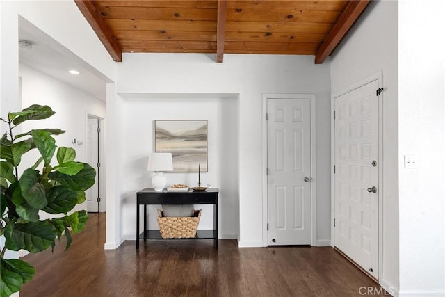 hall with dark hardwood / wood-style flooring, lofted ceiling with beams, and wood ceiling