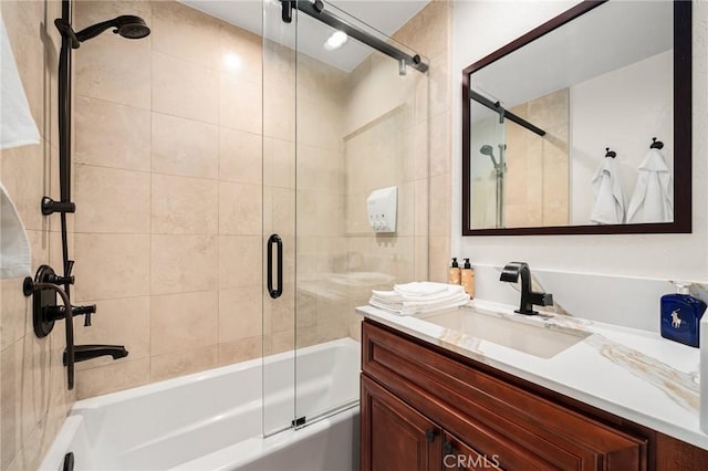 full bathroom featuring shower / bath combination with glass door and vanity