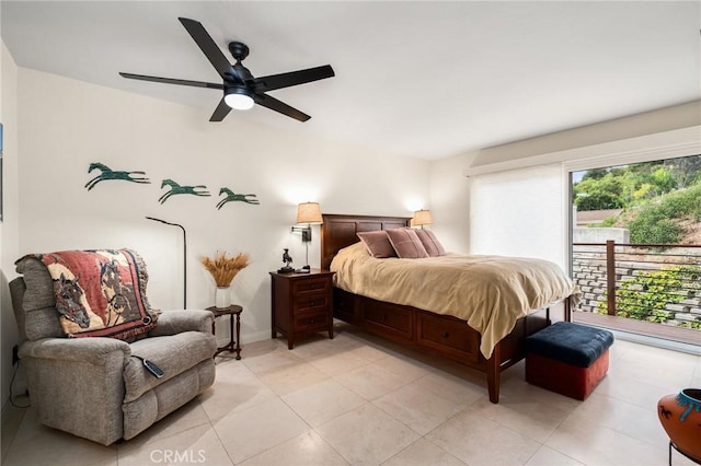 bedroom featuring light tile patterned flooring, ceiling fan, and baseboards