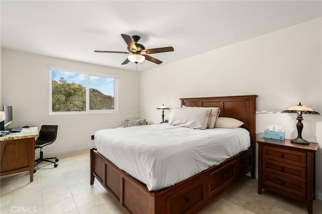 bedroom with ceiling fan and baseboards