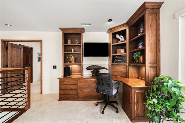 office area with visible vents and built in desk