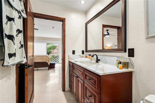 bathroom featuring visible vents, vanity, toilet, and tile patterned floors