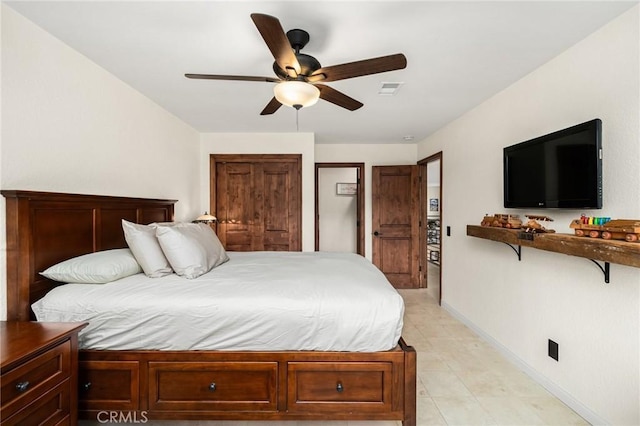 bedroom with light tile patterned floors, baseboards, visible vents, and a ceiling fan