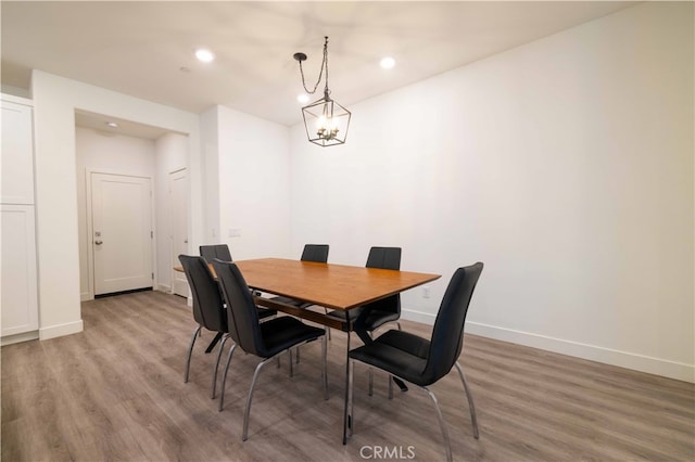 dining space featuring wood-type flooring