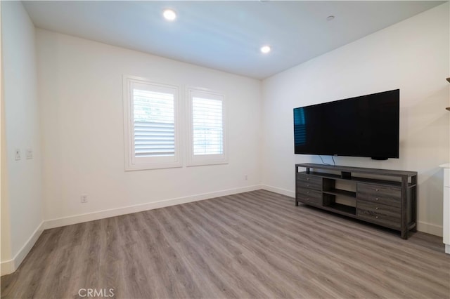 unfurnished living room featuring light wood-type flooring