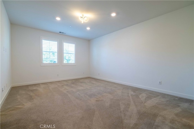 view of carpeted spare room