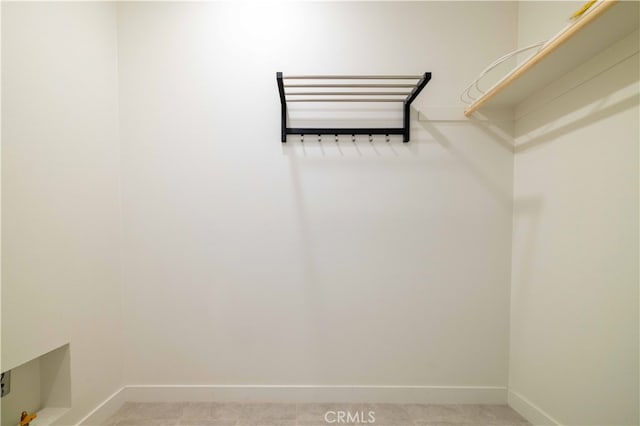 spacious closet featuring tile patterned floors