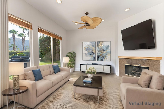 living room with ceiling fan and a mountain view