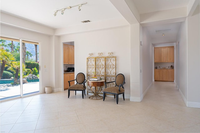 sitting room featuring light tile patterned floors