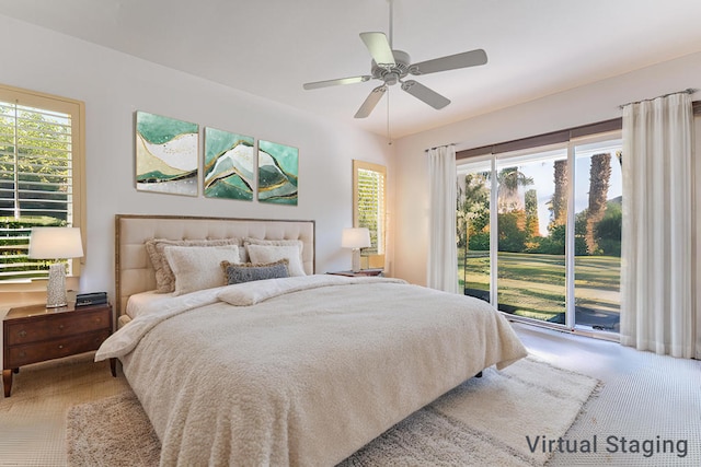 carpeted bedroom featuring ceiling fan and access to exterior