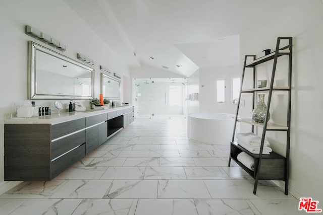 bathroom featuring vanity, separate shower and tub, and vaulted ceiling