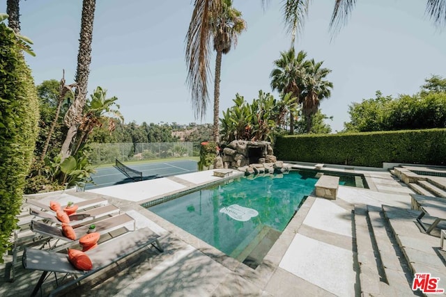 view of swimming pool with a patio