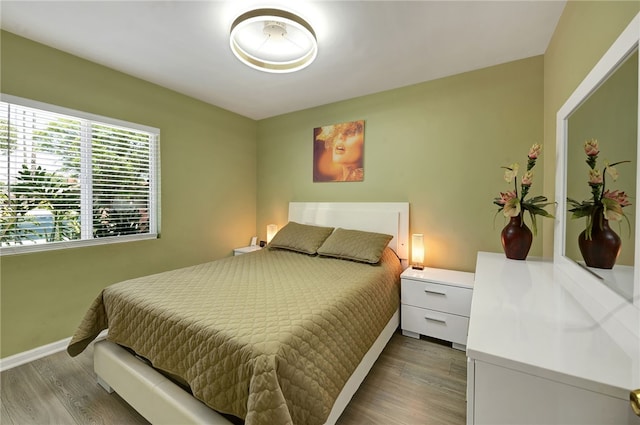 bedroom featuring dark wood-type flooring