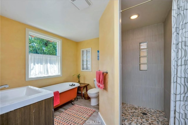 full bathroom with vanity, plus walk in shower, wood-type flooring, and toilet