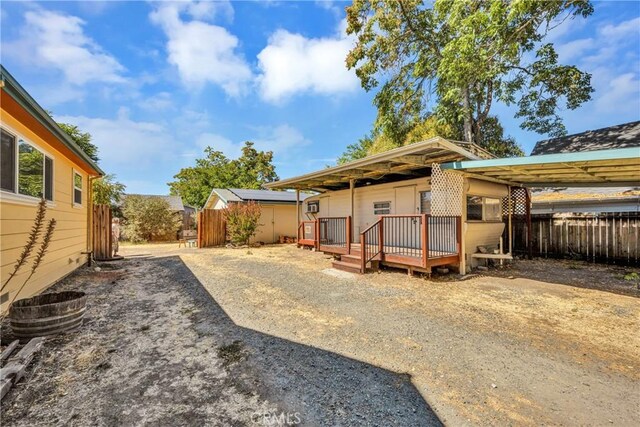 view of yard with a deck and fence