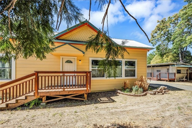 rear view of property with a deck