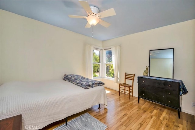 bedroom featuring ceiling fan and light wood-type flooring