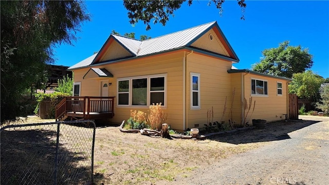 view of home's exterior featuring a deck