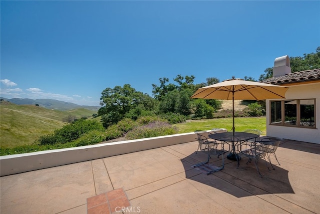 view of patio with a mountain view